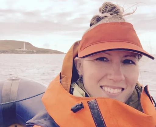 Amanda on a boat in Isla, Scotland